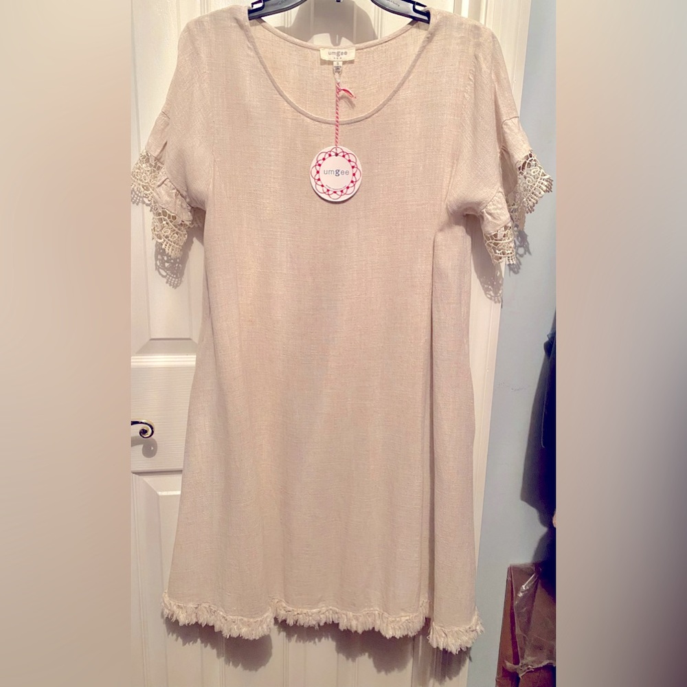 Umgee swing dress, NWT, light tan color, crochet lace on sleeves, fringe hem.